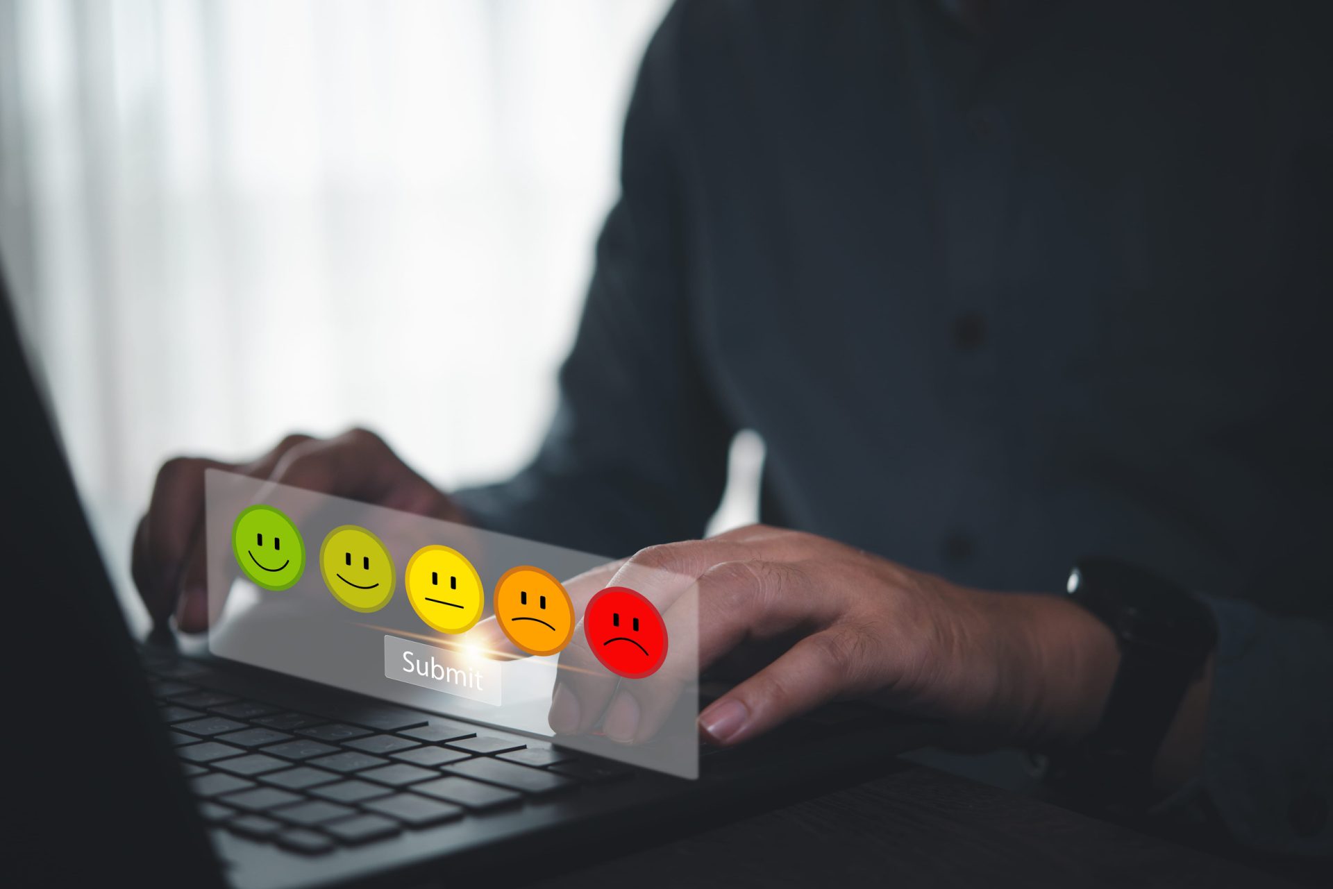 Person using a laptop to submit a customer satisfaction rating, with colorful feedback icons ranging from happy to unhappy, illustrating different types of customer reviews and online feedback.